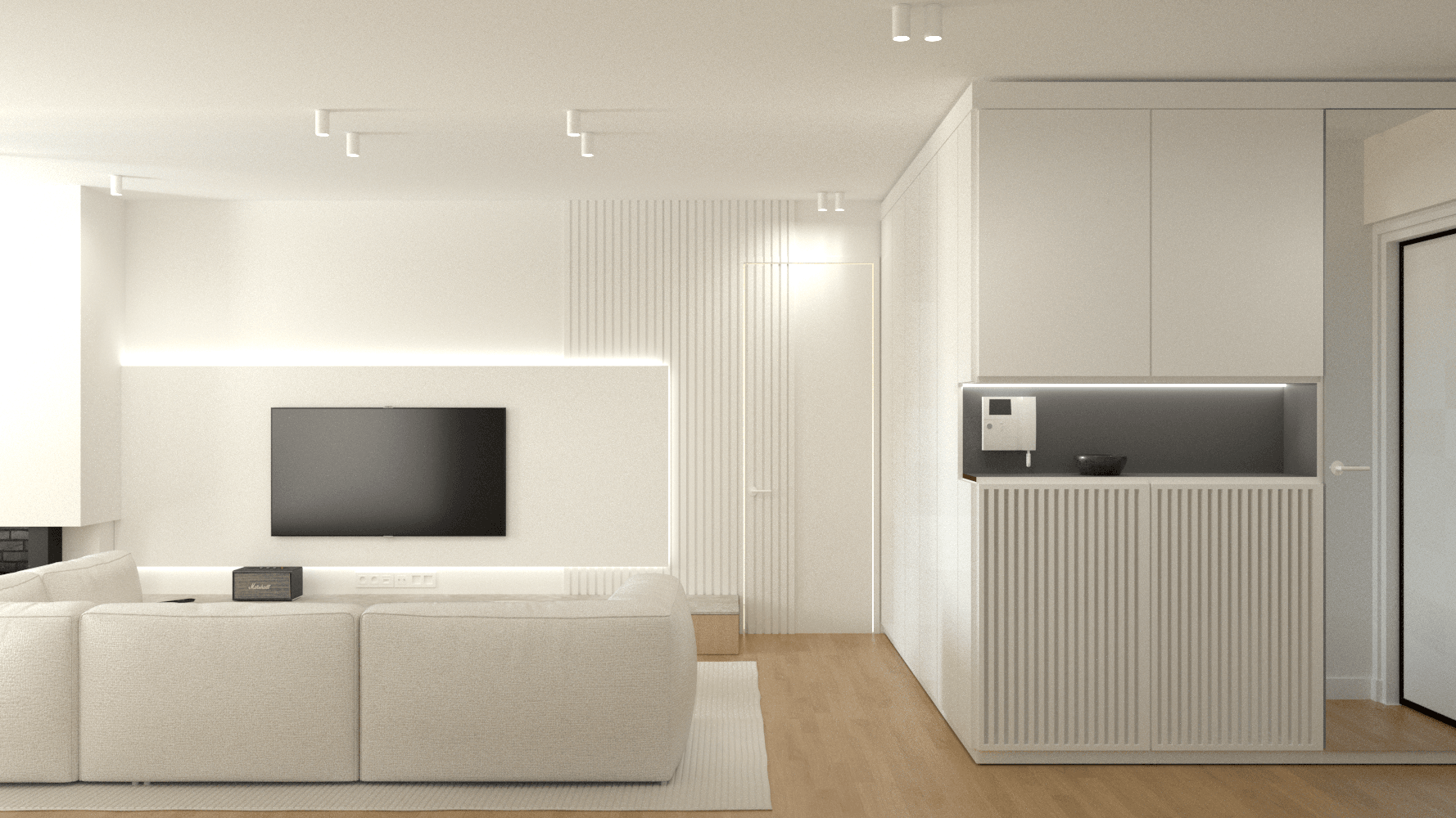 Living room with a white sofa, wall-mounted television and adjoining kitchen — Voulas