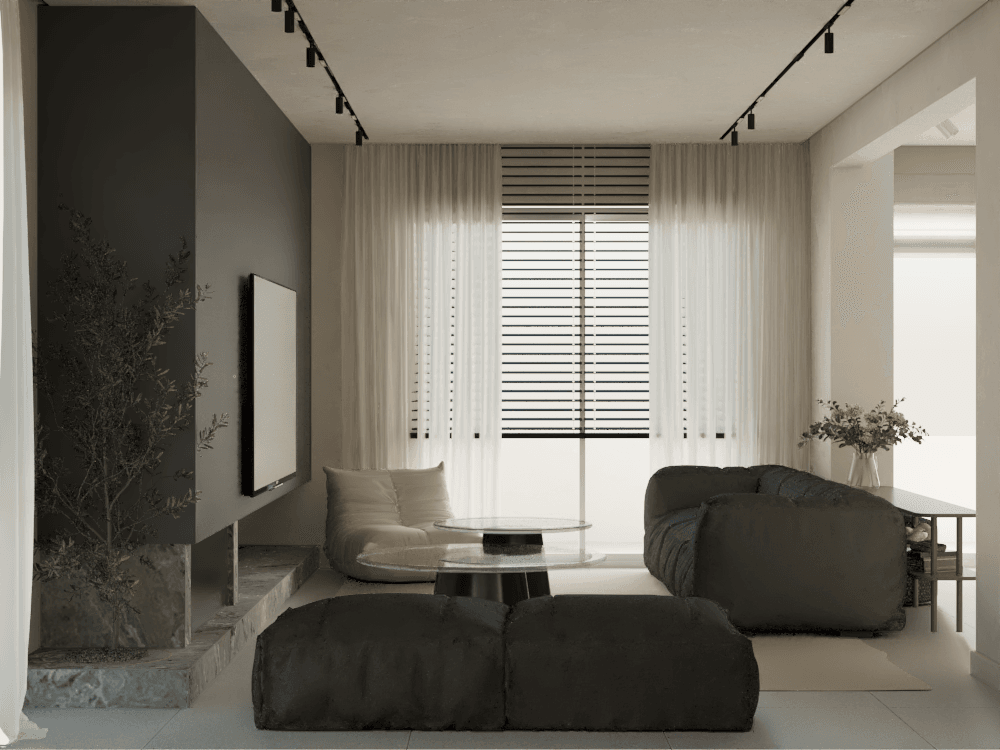 Living area with dark seating beside large windows and a staircase — Gounari 