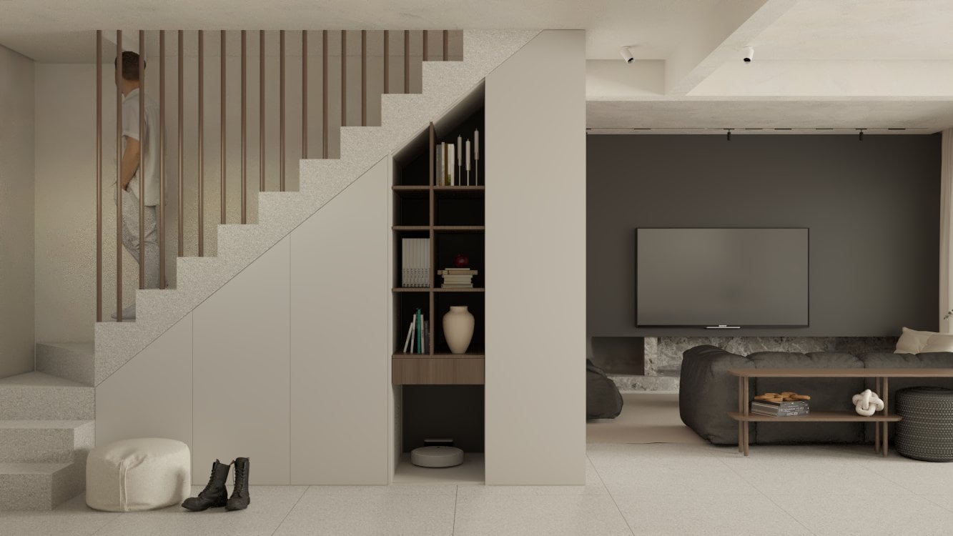 Living room beneath a staircase with a dark accent wall and low seating — Gounari 