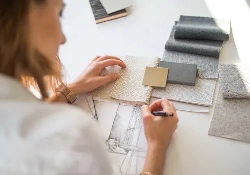 Designer considering neutral material and finish samples
